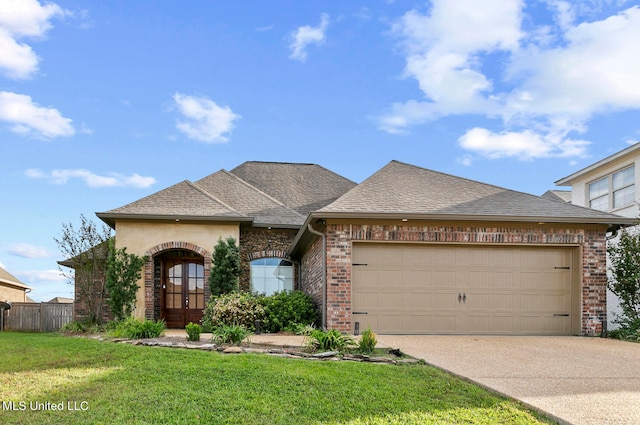 view of front of house with a front lawn and a garage