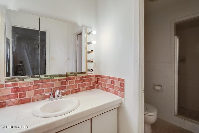 347 Rodenberg Ave, Biloxi, MS 39531 - full bathroom with vanity, toilet, tile walls, and a shower