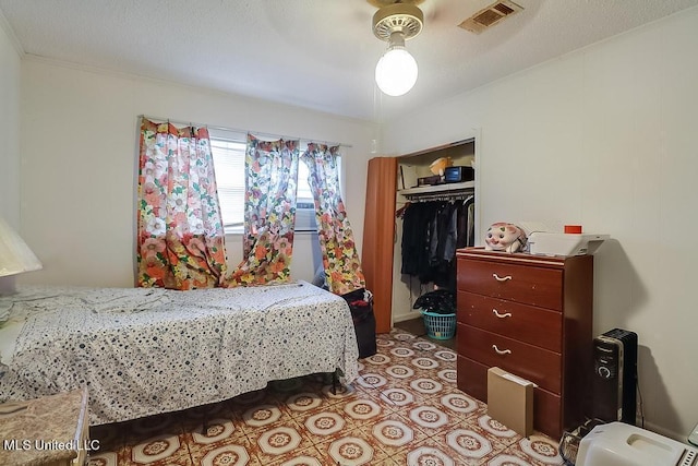 347 Rodenberg Ave, Biloxi, MS 39531 - bedroom with a closet, ornamental molding, and ceiling fan
