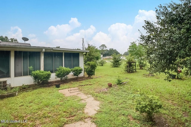 347 Rodenberg Ave, Biloxi, MS 39531 - view of green lawn featuring a sunroom