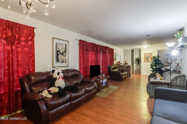 347 Rodenberg Ave, Biloxi, MS 39531 - living area featuring wood finished floors and a chandelier