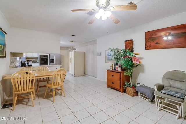 347 Rodenberg Ave, Biloxi, MS 39531 - dining area with a ceiling fan, light tile patterned floors, baseboards, and a textured ceiling