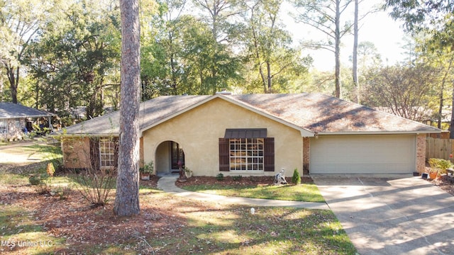 ranch-style home featuring a garage