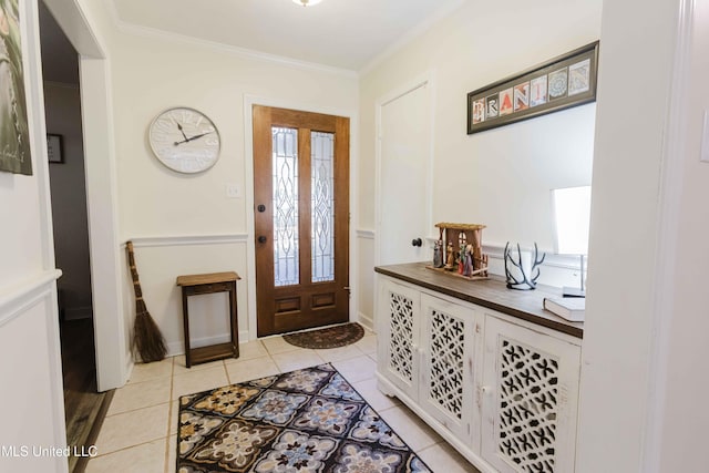 entrance foyer with light tile patterned floors and crown molding