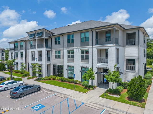 2501 Bienville Blvd Unit 334, Ocean Springs, MS 39564 - view of property featuring uncovered parking