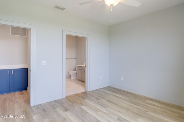 2501 Bienville Blvd Unit 334, Ocean Springs, MS 39564 - unfurnished bedroom with light wood-style flooring, ensuite bath, and ceiling fan