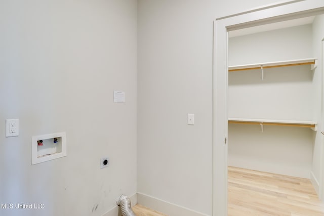 2501 Bienville Blvd Unit 334, Ocean Springs, MS 39564 - laundry area featuring electric dryer hookup, hookup for a washing machine, wood finished floors, and baseboards