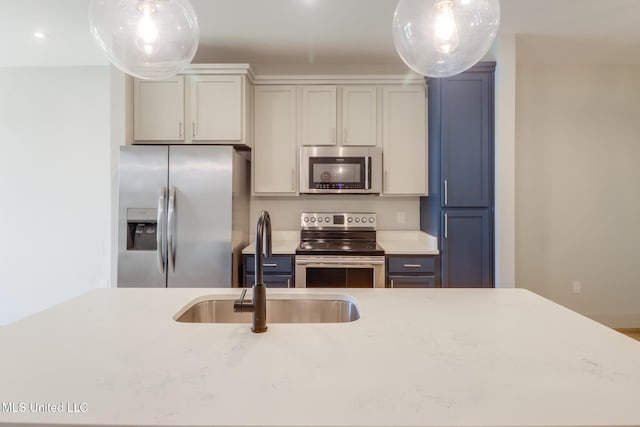 2501 Bienville Blvd Unit 334, Ocean Springs, MS 39564 - kitchen featuring stainless steel appliances, a sink, decorative light fixtures, recessed lighting, and light stone counters