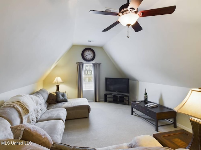 living area featuring vaulted ceiling, a ceiling fan, visible vents, and light colored carpet