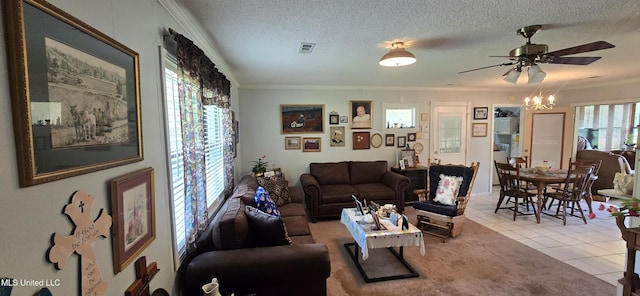308 Walnut St, Benoit, MS 38725 - tiled living room with ornamental molding, a ceiling fan, a textured ceiling, and a chandelier