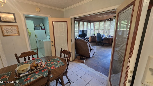 308 Walnut St, Benoit, MS 38725 - tiled dining room featuring washer and dryer and ornamental molding