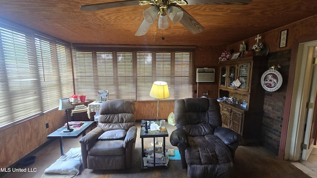 308 Walnut St, Benoit, MS 38725 - living area featuring ceiling fan, wooden walls, a wall unit AC, and wooden ceiling