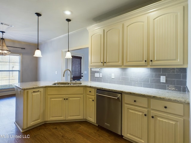 kitchen featuring hanging light fixtures, dishwasher, sink, and tasteful backsplash