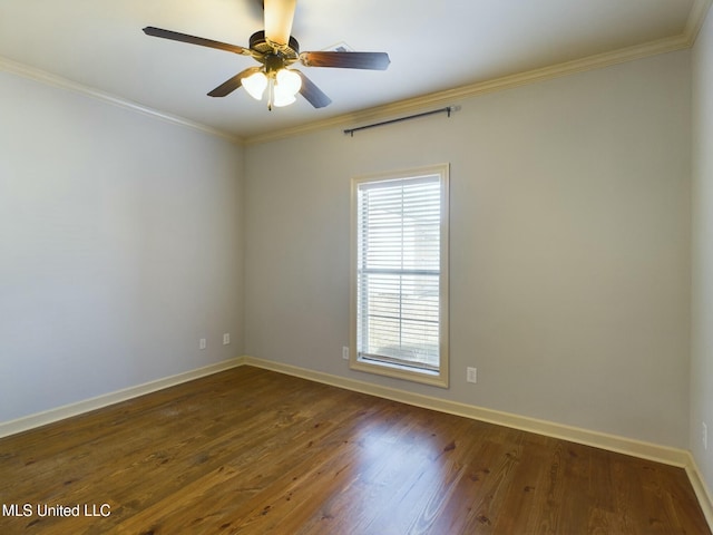 empty room with ceiling fan, crown molding, and dark hardwood / wood-style floors