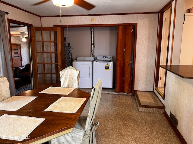 dining area featuring a textured ceiling, washer and clothes dryer, ornamental molding, and ceiling fan