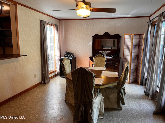 dining area featuring ceiling fan and crown molding