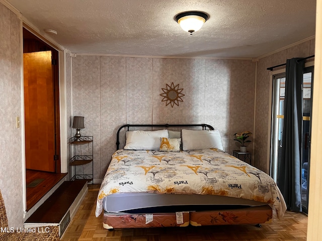 bedroom with crown molding, a textured ceiling, and parquet flooring