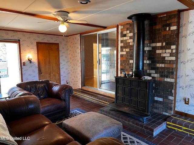 living room with a wealth of natural light and ceiling fan