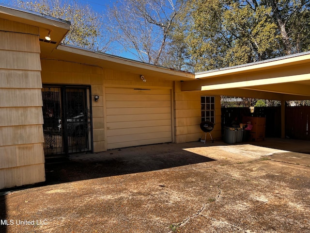 exterior space with a carport