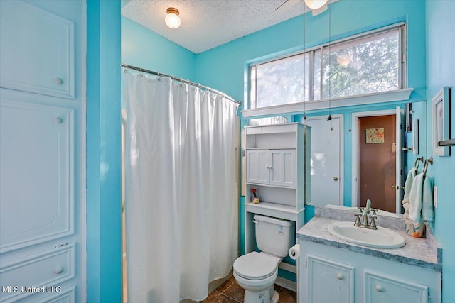 full bath featuring vanity, toilet, a textured ceiling, a ceiling fan, and curtained shower