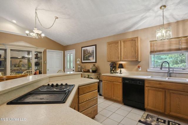 19639 Laterre Dr, Kiln, MS 39556 - kitchen with a chandelier, black appliances, light countertops, lofted ceiling, and light tile patterned floors