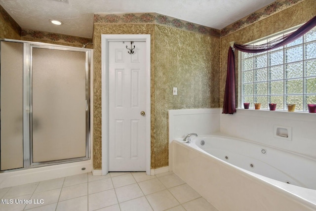 19639 Laterre Dr, Kiln, MS 39556 - bathroom with a stall shower, a tub with jets, tile patterned flooring, and a textured ceiling