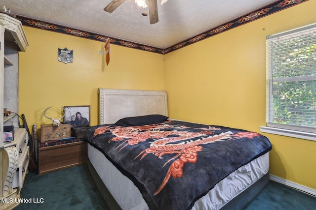 19639 Laterre Dr, Kiln, MS 39556 - carpeted bedroom with multiple windows, a textured ceiling, and ceiling fan