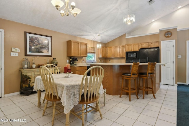 19639 Laterre Dr, Kiln, MS 39556 - dining space featuring a chandelier, vaulted ceiling, and light tile patterned flooring