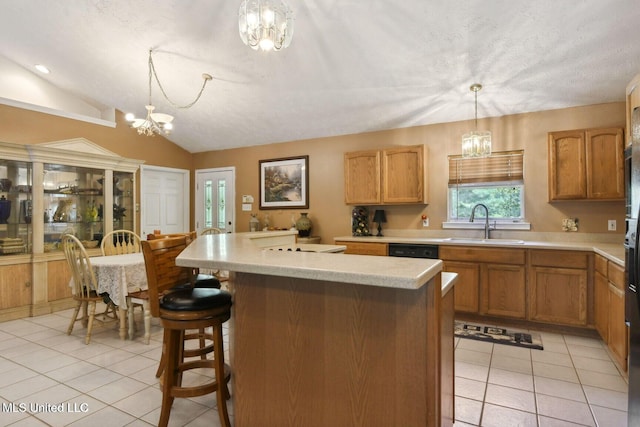 19639 Laterre Dr, Kiln, MS 39556 - kitchen with a chandelier, light tile patterned floors, light countertops, a kitchen island, and lofted ceiling