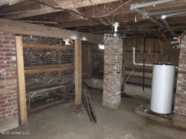 basement with brick wall and gas water heater