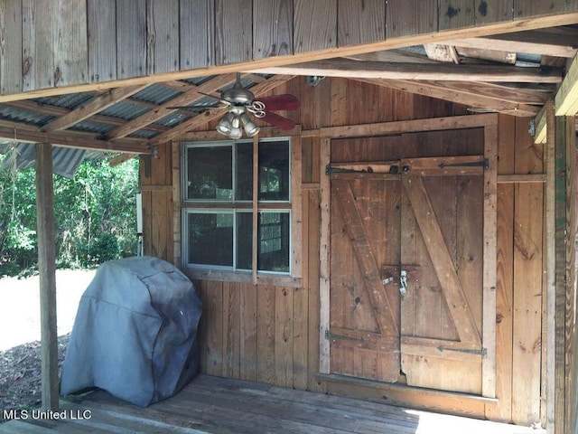 exterior space featuring ceiling fan