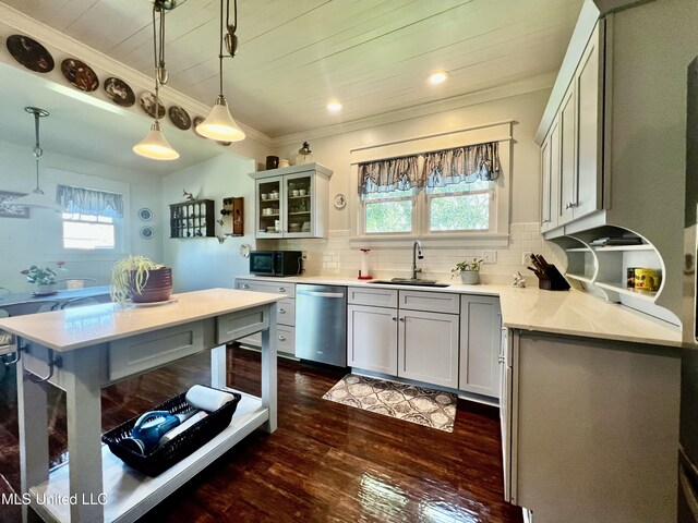 914 39th Ave, Gulfport, MS 39501 - kitchen featuring dishwasher, a sink, dark wood-type flooring, hanging light fixtures, and ornamental molding