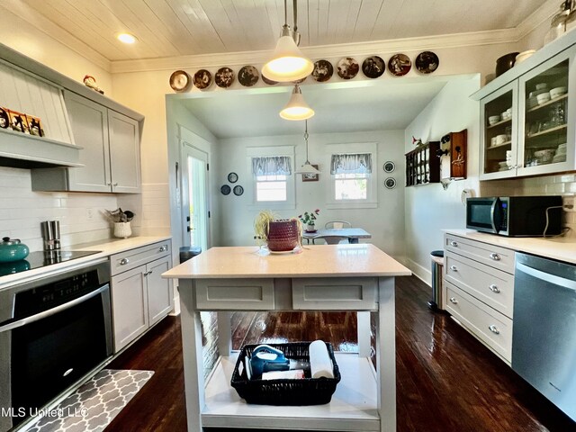 914 39th Ave, Gulfport, MS 39501 - kitchen with black appliances, light countertops, glass insert cabinets, dark wood-style flooring, and crown molding