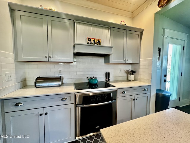 914 39th Ave, Gulfport, MS 39501 - kitchen featuring oven, black electric stovetop, gray cabinetry, and crown molding