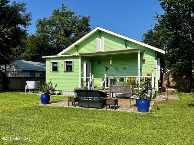 914 39th Ave, Gulfport, MS 39501 - rear view of house featuring an outdoor hangout area and a patio area