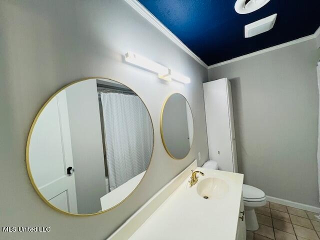 bathroom featuring toilet, tile patterned flooring, a shower with curtain, ornamental molding, and vanity