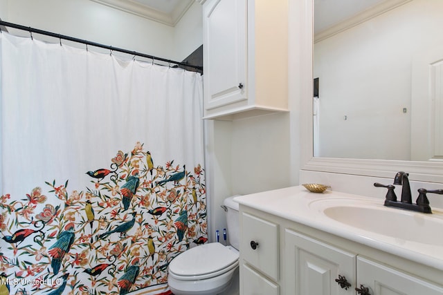 bathroom with toilet, crown molding, and vanity