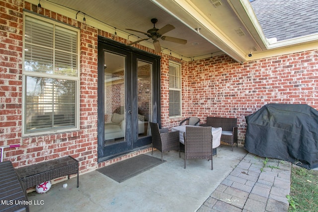 view of patio featuring ceiling fan and a grill