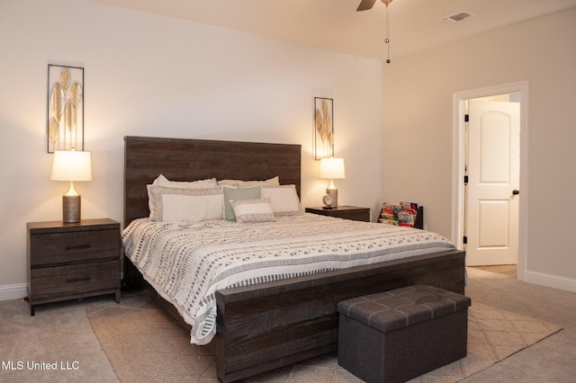 bedroom with carpet floors, visible vents, and baseboards