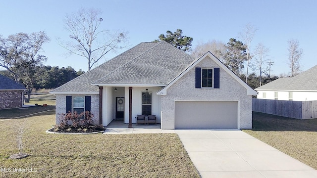 view of front facade with brick siding, fence, driveway, roof with shingles, and a front lawn