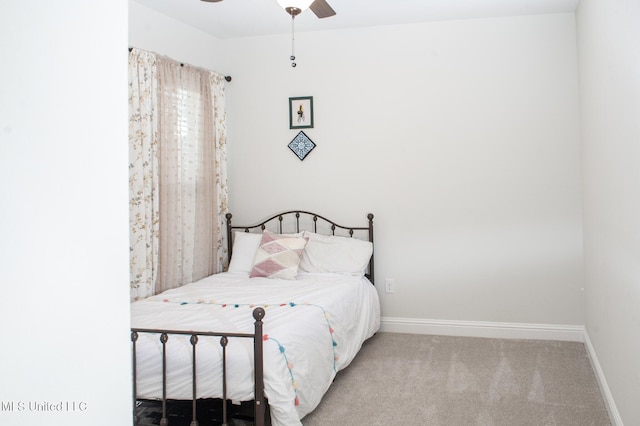 bedroom with carpet flooring, a ceiling fan, and baseboards