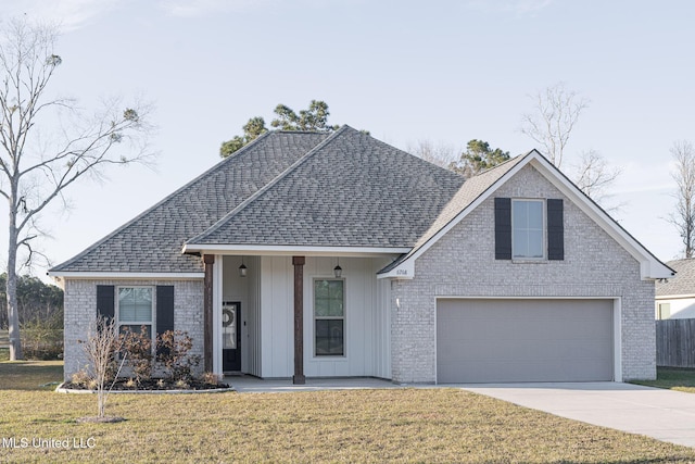 view of front facade featuring driveway, a shingled roof, a front lawn, and board and batten siding