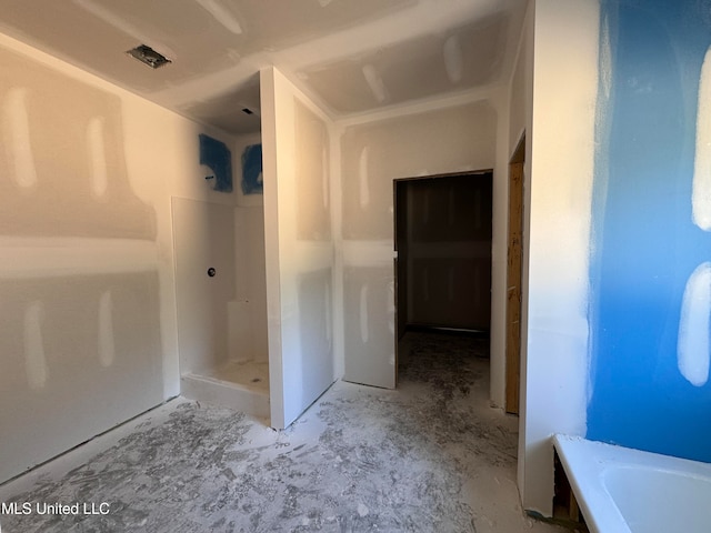 bathroom featuring plus walk in shower and concrete floors