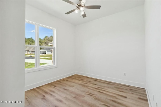 213 Dolly Ln, Magee, MS 39111 - unfurnished room with light wood finished floors, baseboards, and a ceiling fan