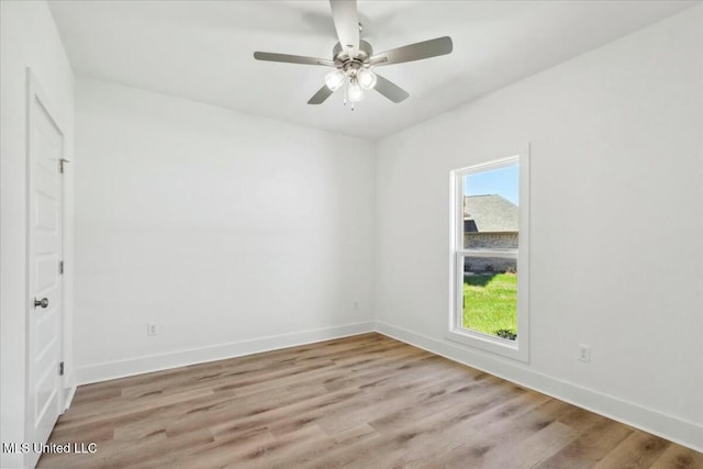 213 Dolly Ln, Magee, MS 39111 - unfurnished bedroom with multiple windows, light wood-style flooring, baseboards, and a ceiling fan
