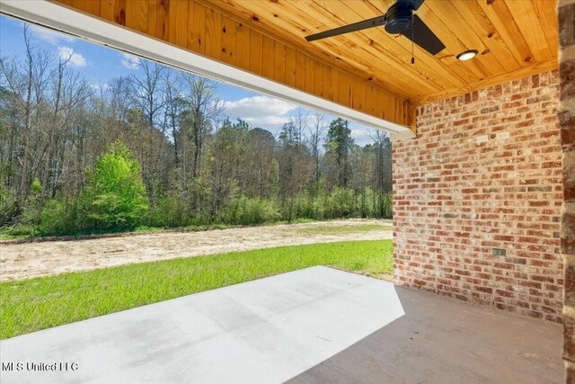 213 Dolly Ln, Magee, MS 39111 - view of patio featuring ceiling fan and a view of trees