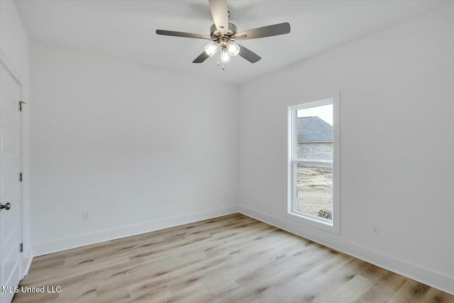 spare room featuring ceiling fan, plenty of natural light, and light hardwood / wood-style flooring