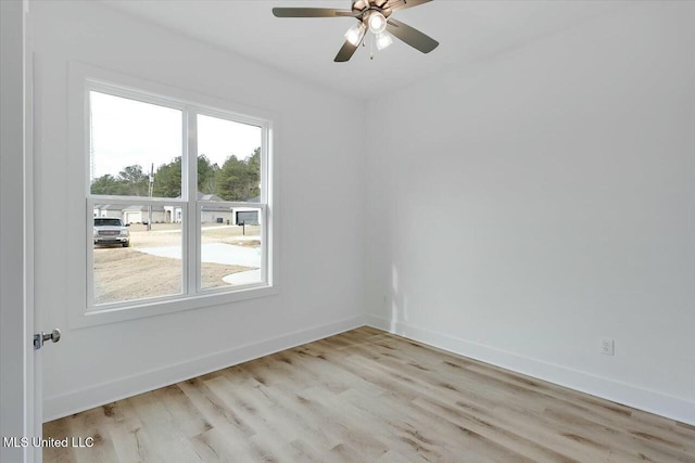 spare room with ceiling fan and light hardwood / wood-style floors