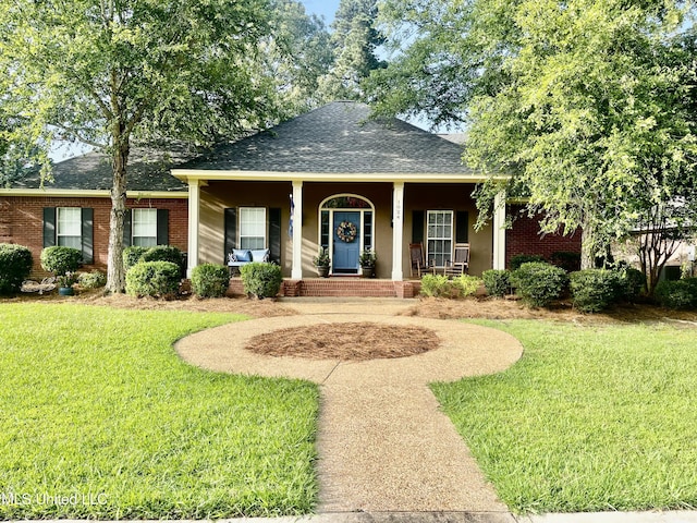 1024 Riverchase N Dr, Brandon, MS 39047 - view of front of property with a shingled roof, a porch, a front yard, and brick siding