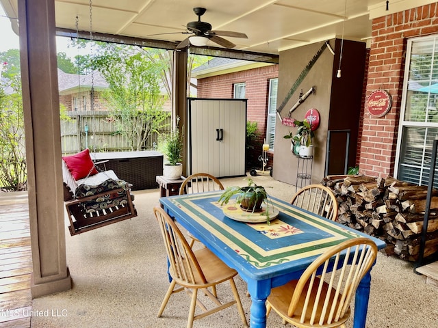 1024 Riverchase N Dr, Brandon, MS 39047 - view of patio / terrace featuring ceiling fan, outdoor dining area, and a storage unit